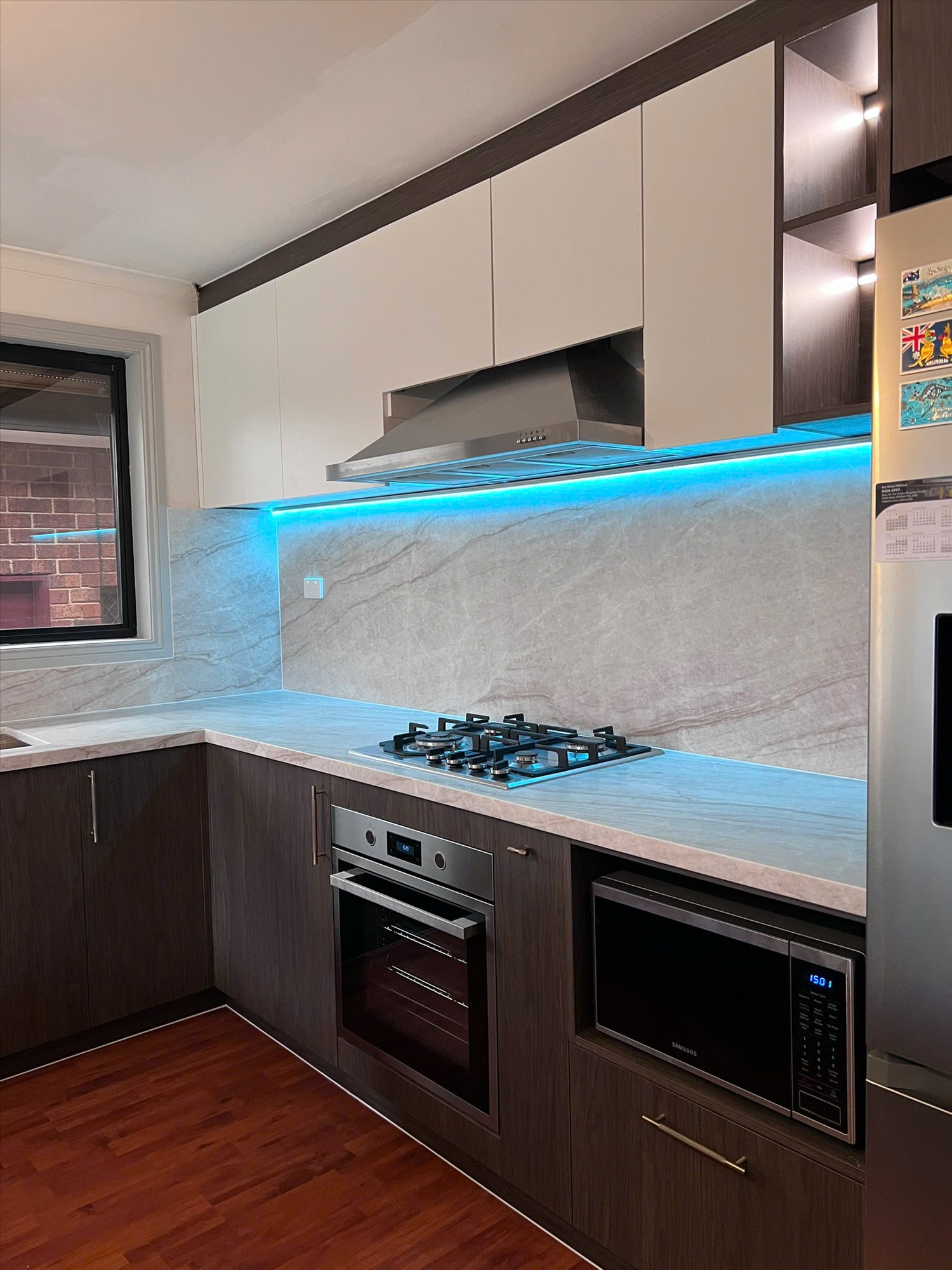 Completed kitchen with illuminated splashback